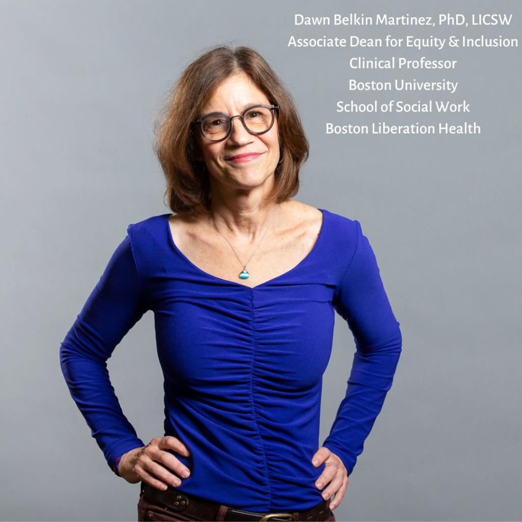This image shows Dr. Dawn Belkin Martinez. She is a light brown woman with light brown hair to her shoulders, red glasses, and wearing a blue long-sleeve top.